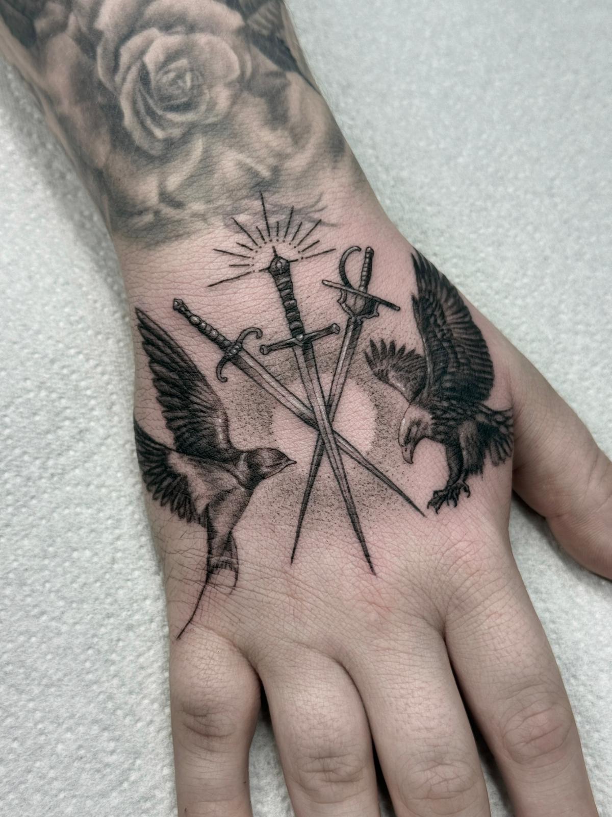 Three Crossed Swords and Birds Hand Tattoo