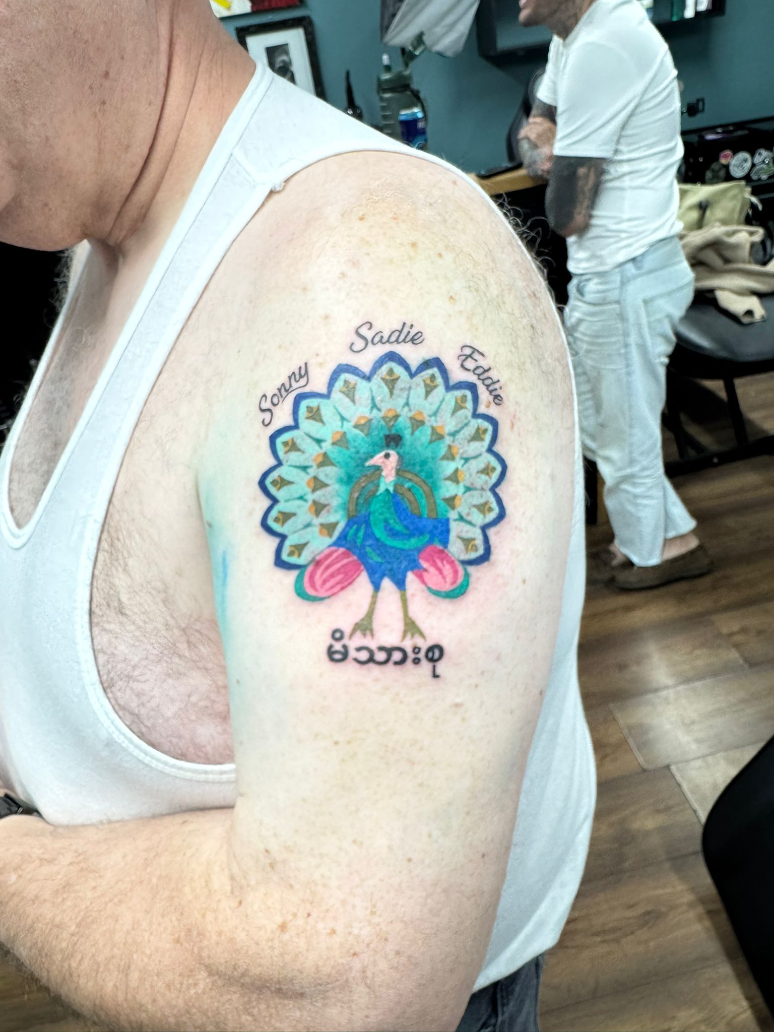 Peacock Family Names Tattoo